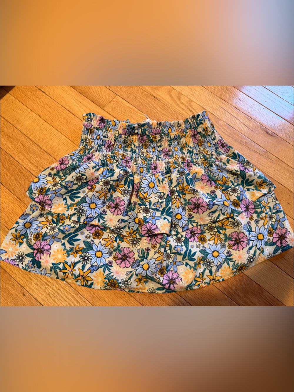 Miken Floral Smocked Waist Mini Skirt in Yellow, Pink & Blue